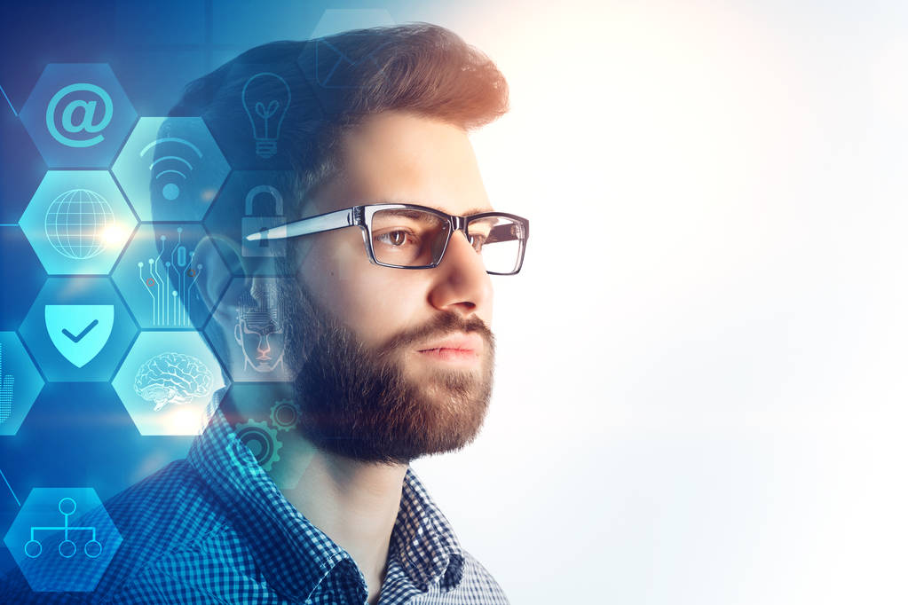 Side portrait of handsome young european businessman with glowing blue business hologram and copy space. Finance and future concept. Double exposure  - Photo, Image