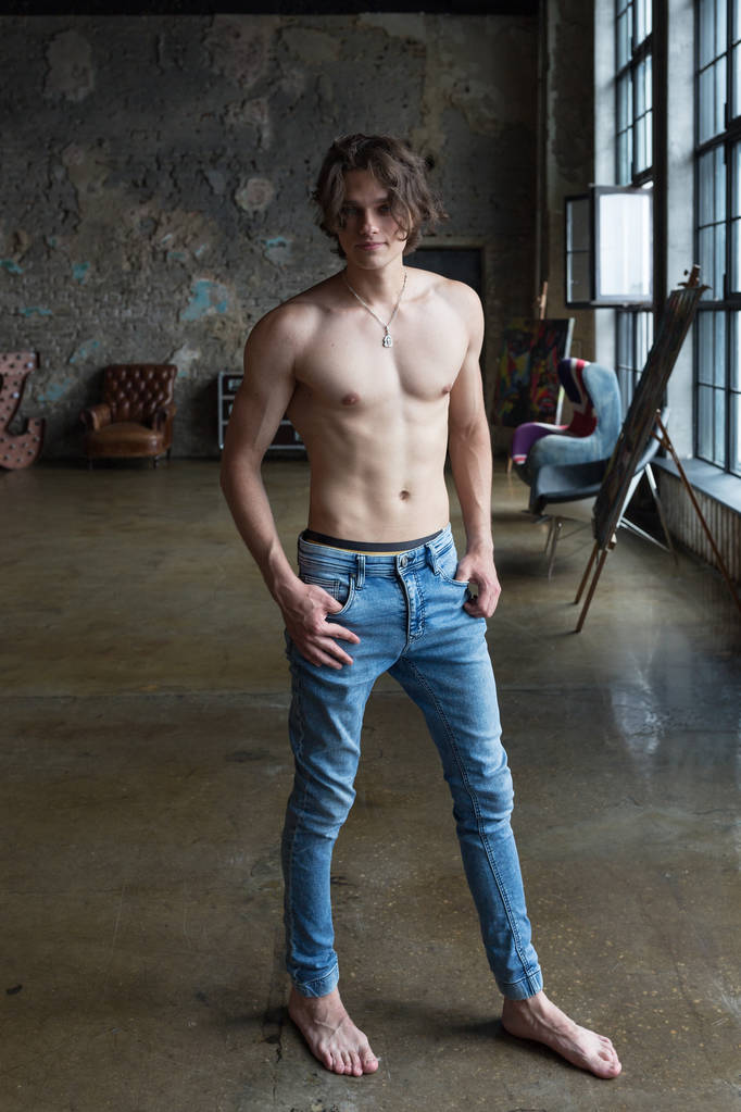 Handsome blond male model with blue eyes full body posing indoors - Photo, Image