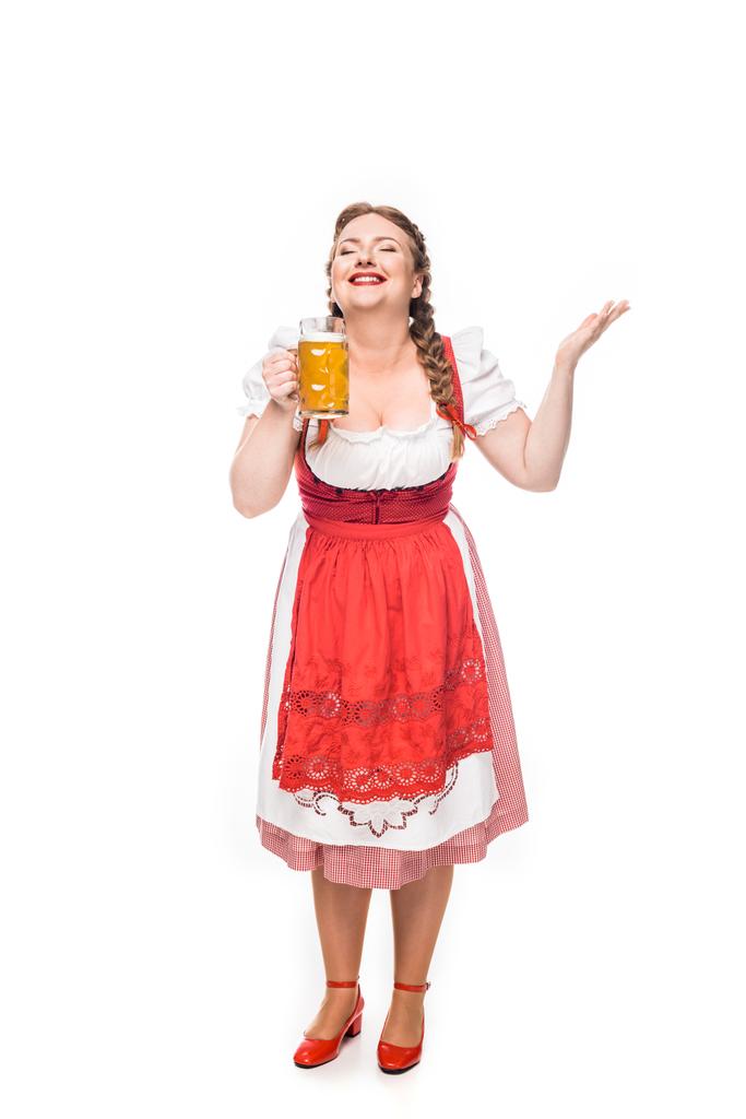 excited oktoberfest waitress in traditional bavarian dress smelling light beer isolated on white background - Photo, Image