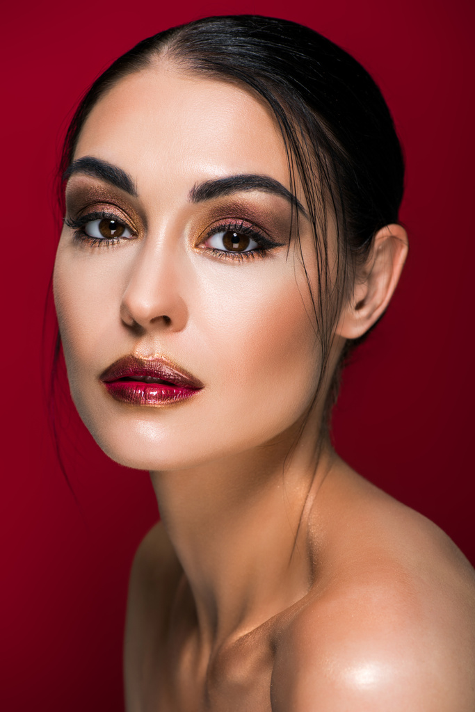 portrait of beautiful nude girl with makeup, isolated on red - Photo, Image