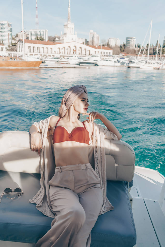 luxurious stylish woman sailing the Caribbean sea to the island, a long-awaited vacation - Photo, Image