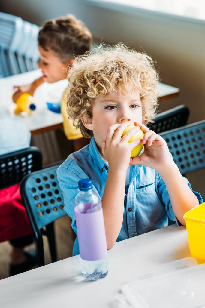 adorable curly schoolboy taking lunch together at  school cafeteria - Photo, Image