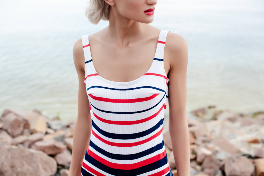 cropped view of woman in retro striped swimsuit - Photo, Image
