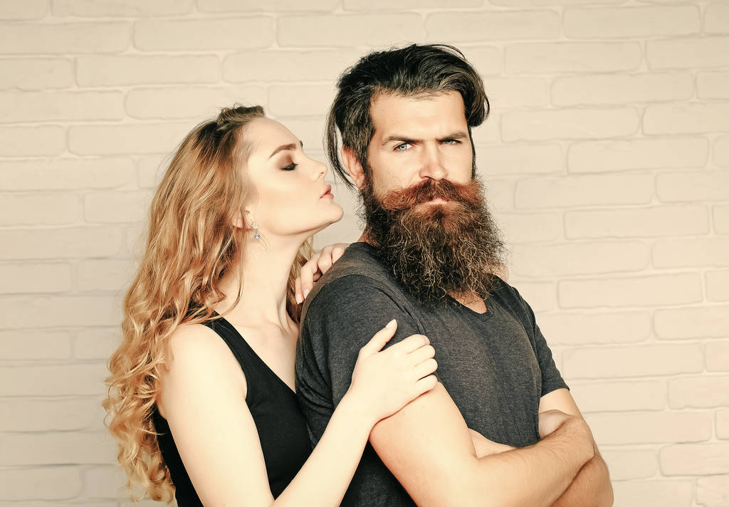 Girl and bearded hipster. Fashion, beauty, style concept. - Photo, Image