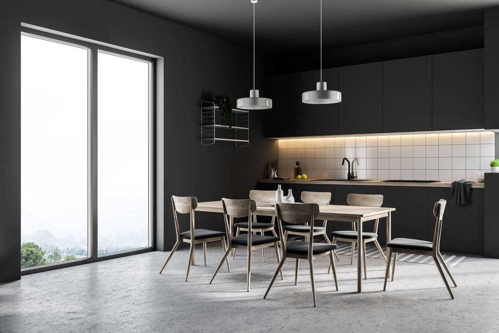 Tuindeuren keukenhoek met zwarte muren, een betonnen vloer, een tafel met stoelen en countertops van de zwarte. 3D-rendering - Foto, afbeelding