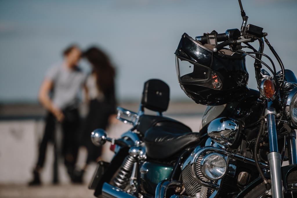 selective focus of classical motorcycle with bikers on background - Photo, Image