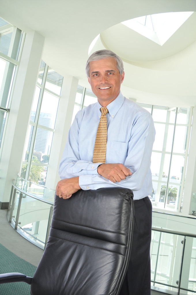 Businessman Leaning on Chair - Photo, Image
