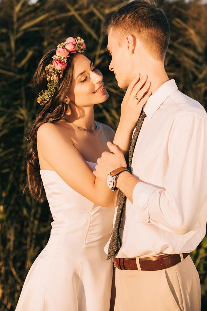 beautiful happy young tender wedding couple able to kiss - Photo, Image