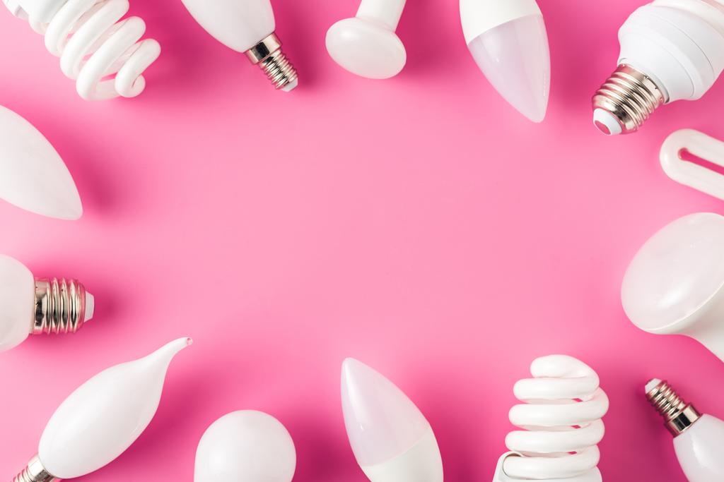 top view of various light bulbs on pink background, energy concept  - Photo, Image