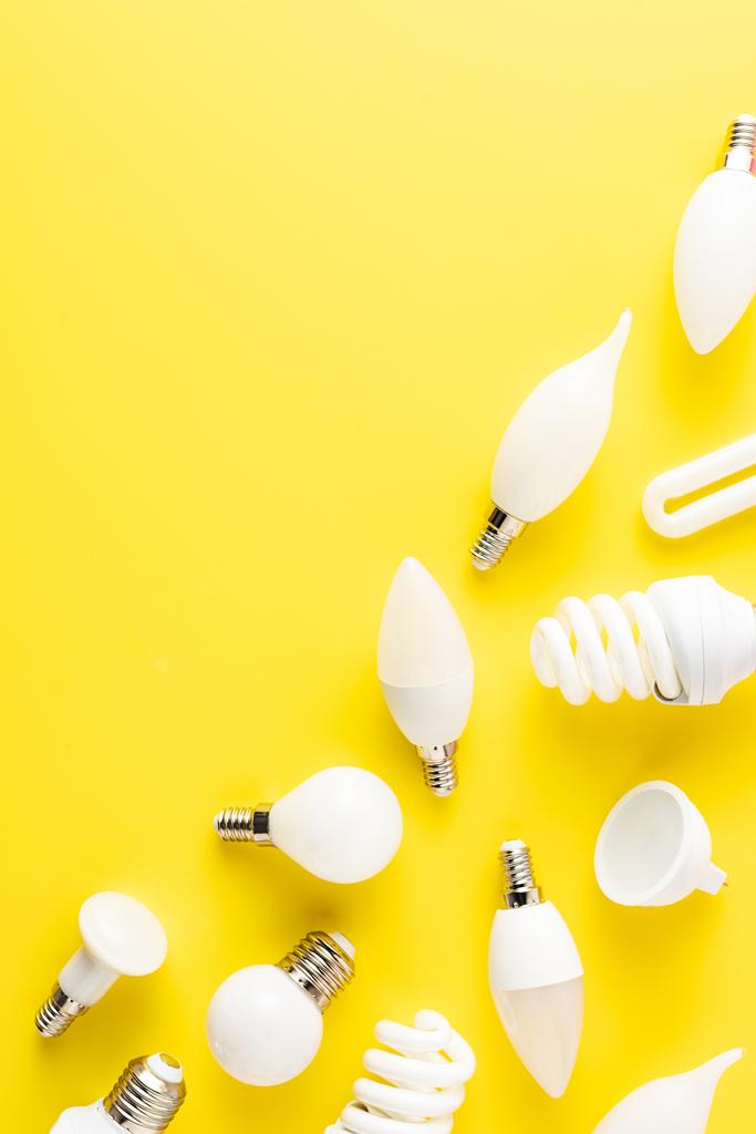 top view of various types of light bulbs on yellow background  - Photo, Image