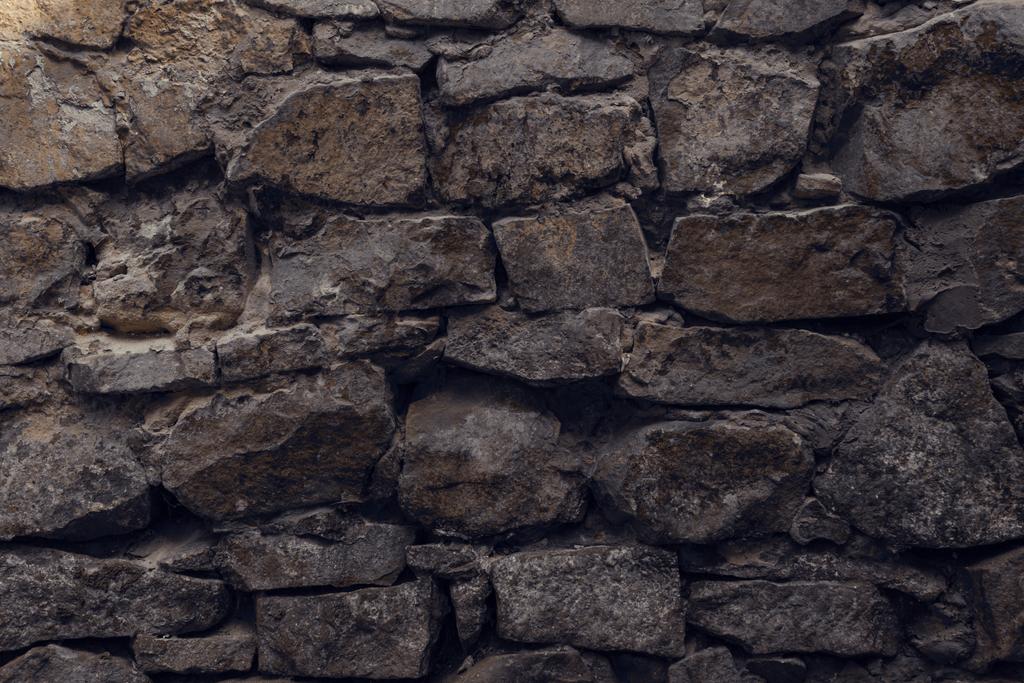 közeli Nézd a régi viharvert durva szürke fal texturált háttér   - Fotó, kép