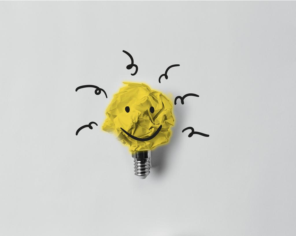 top view of crumpled paper as light bulb with smile - Photo, Image