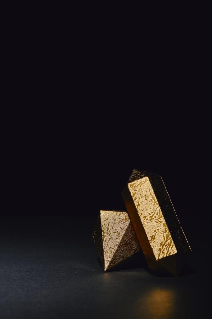 glittering faceted pieces of gold on black background - Photo, Image