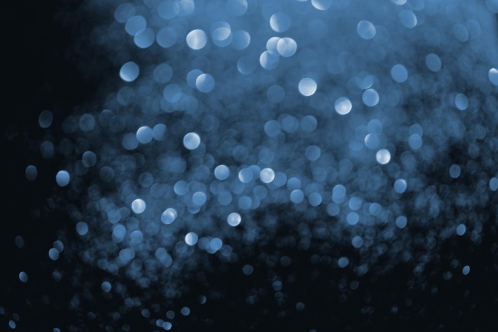 abstracte achtergrond met wazig gloeiende blauwe glitter   - Foto, afbeelding