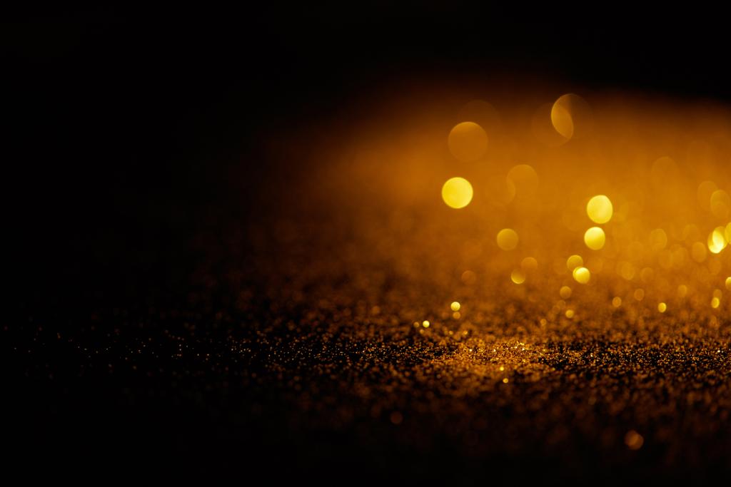 Blurred Gold Glitter On Dark Background Free Stock Photo and Image