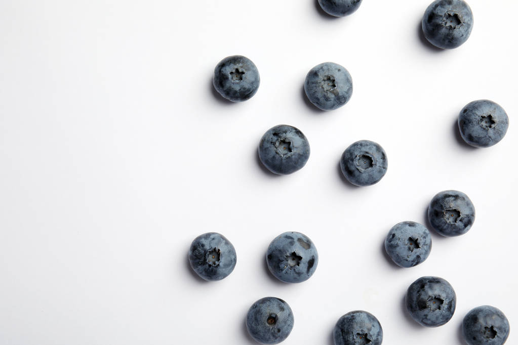 Flat lay composition with tasty blueberry and space for text on white background - Photo, Image