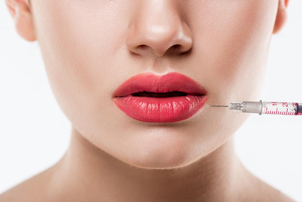 close up of woman making beauty injection in lips, isolated on white - Photo, Image