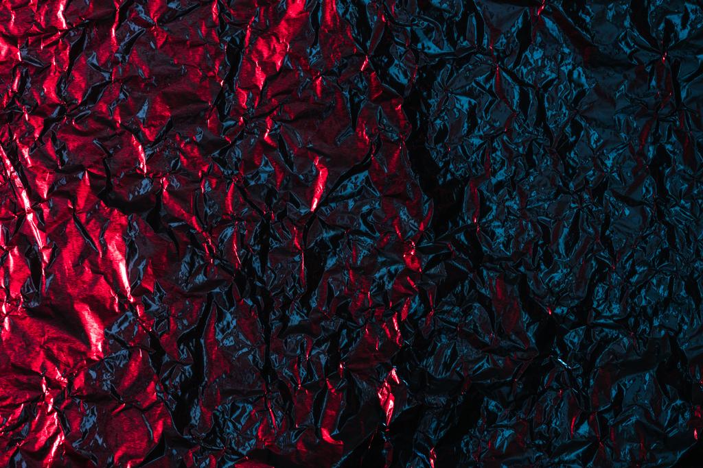 Třpytivé pozadí abstraktní zmačkaný červené a černé fólie - Fotografie, Obrázek