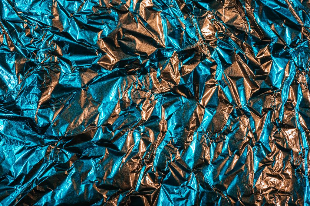 όμορφη λαμπερά αφηρημένη τσαλακωμένο αλουμινόχαρτο φόντο - Φωτογραφία, εικόνα