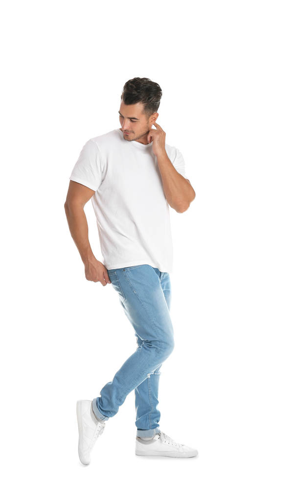 Young man in stylish jeans on white background - Photo, Image