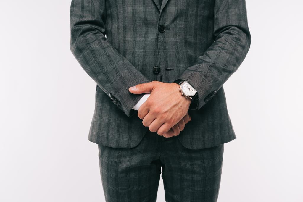 image recadrée de l'homme d'affaires debout en costume avec montre-bracelet isolé sur blanc
 - Photo, image