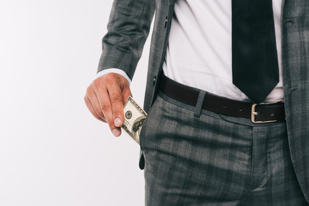 cropped image of businessman taking dollar from pocket isolated on white - Photo, Image