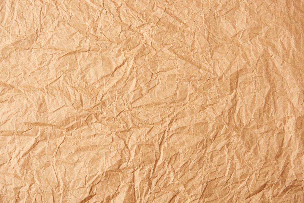 full frame of beige crumpled paper as background - Photo, Image