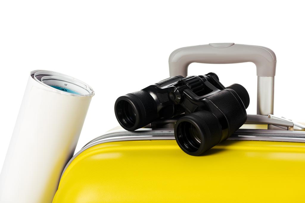 close up view of yellow suitcase, map and binoculars isolated on white - Photo, Image