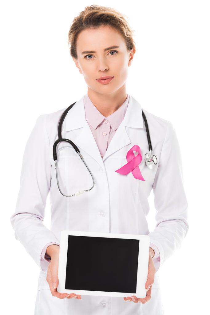doctor with pink ribbon holding digital tablet with blank screen and looking at camera isolated on white, breast cancer awareness concept   - Photo, Image