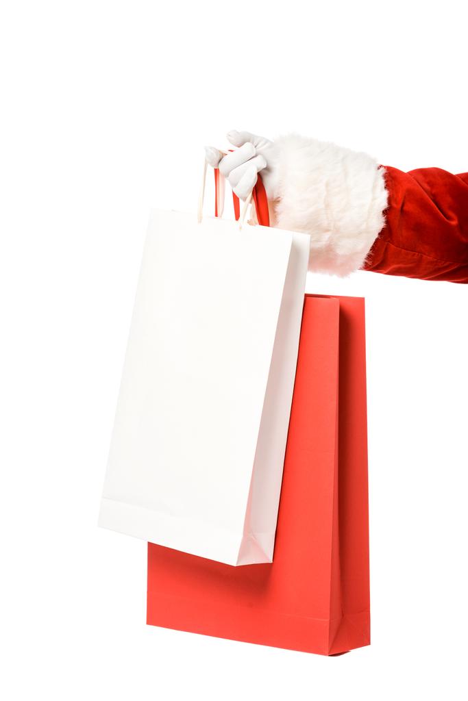 ritagliato colpo di Babbo Natale in possesso di sacchetti di carta isolati su bianco
 - Foto, immagini