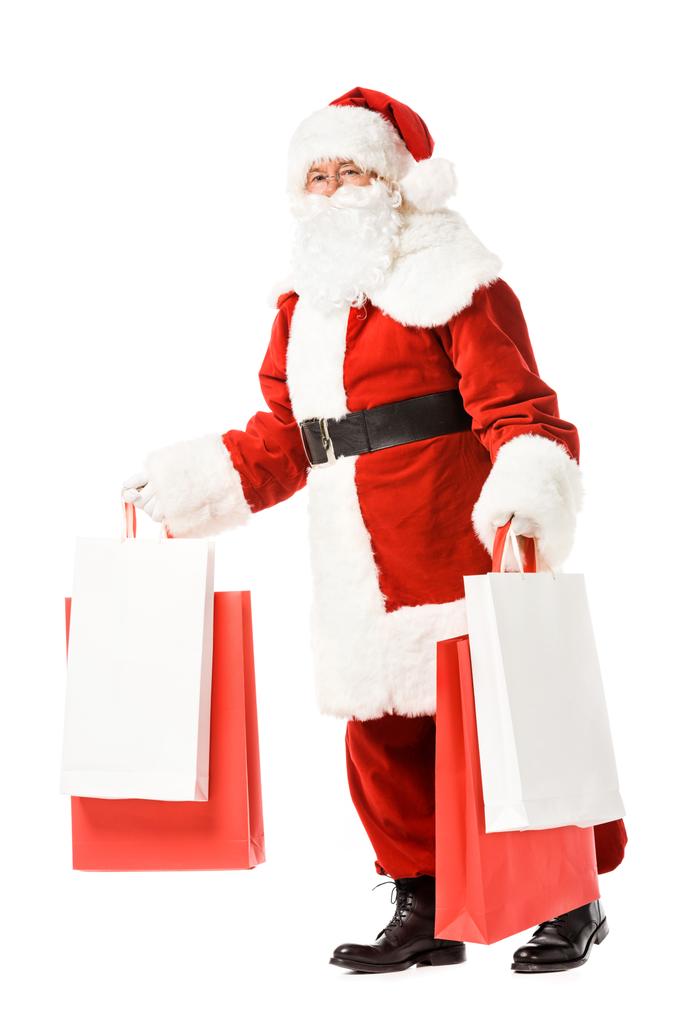 Santa claus chodzenie z torby papierowe w ręce na białym tle - Zdjęcie, obraz