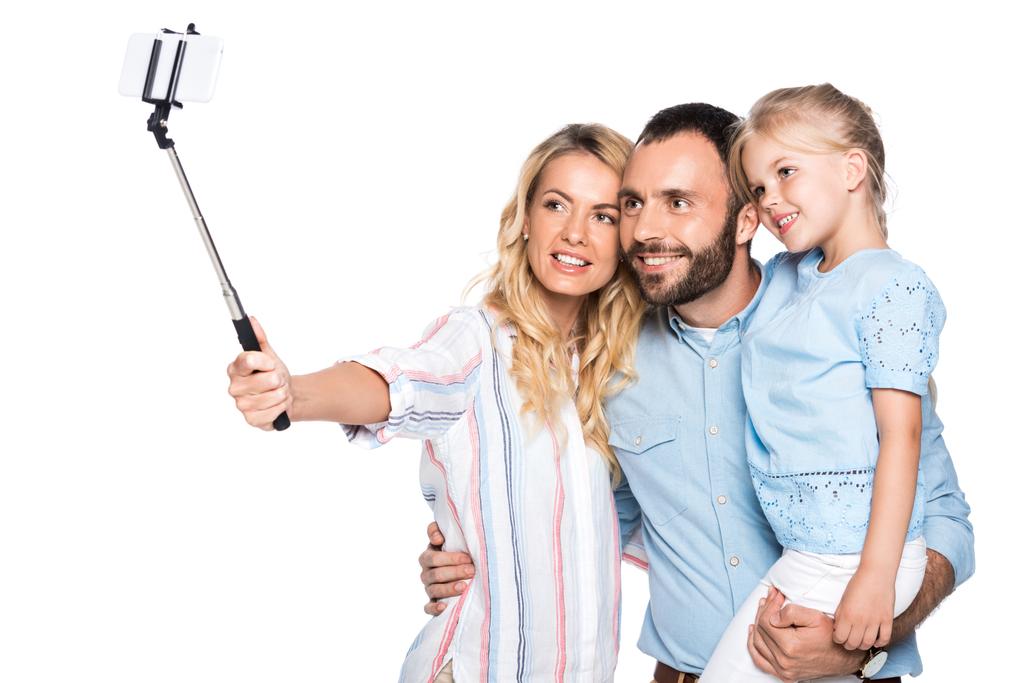 白で隔離のスマート フォン selfie を取って家族 - 写真・画像