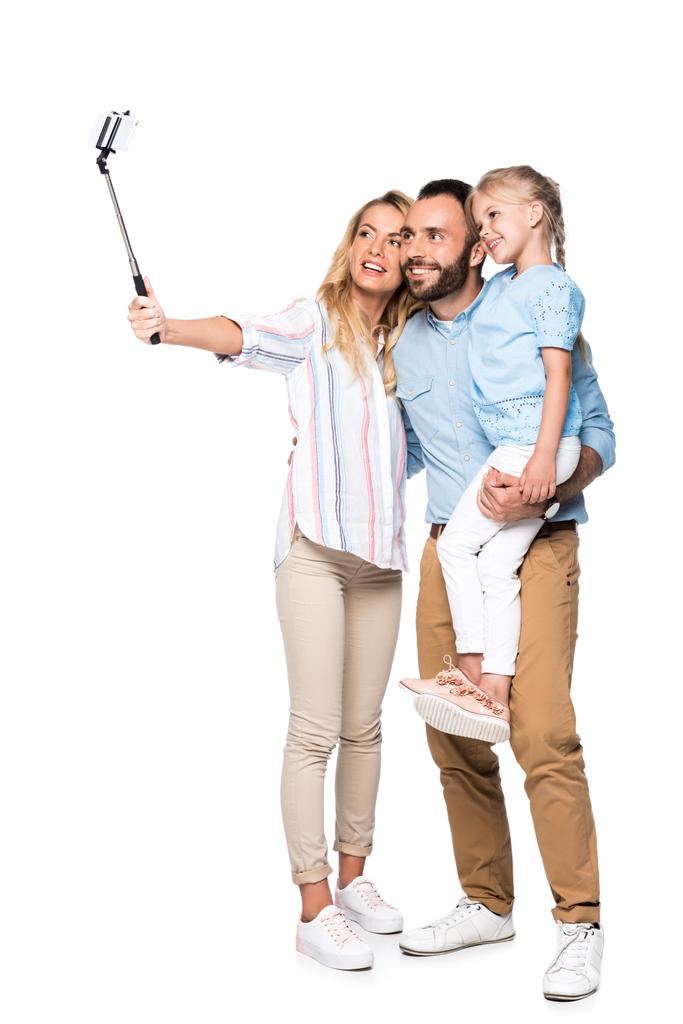 gülümseyen aile selfie smartphone üzerinde beyaz izole taking - Fotoğraf, Görsel