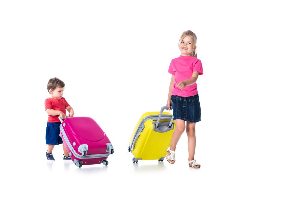 siblings with travel bags isolated on white - Photo, Image