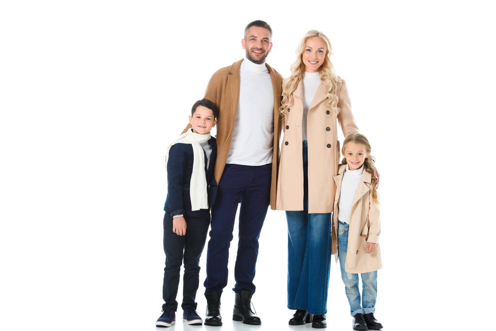 stylish parents hugging happy kids in beige coats, isolated on white - Photo, Image