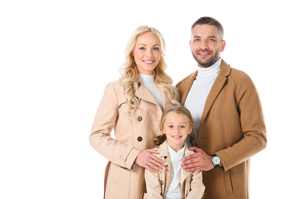 smiling family with daughter in beige autumn coats, isolated on white - Photo, Image