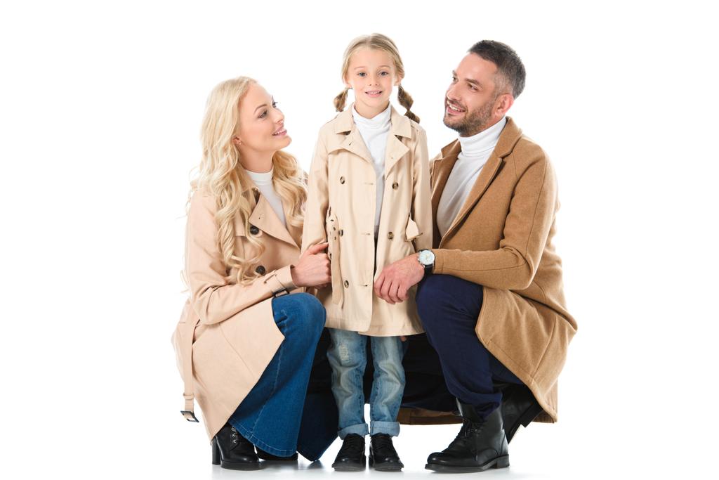 parents with daughter in beige autumn coats, isolated on white - Photo, Image