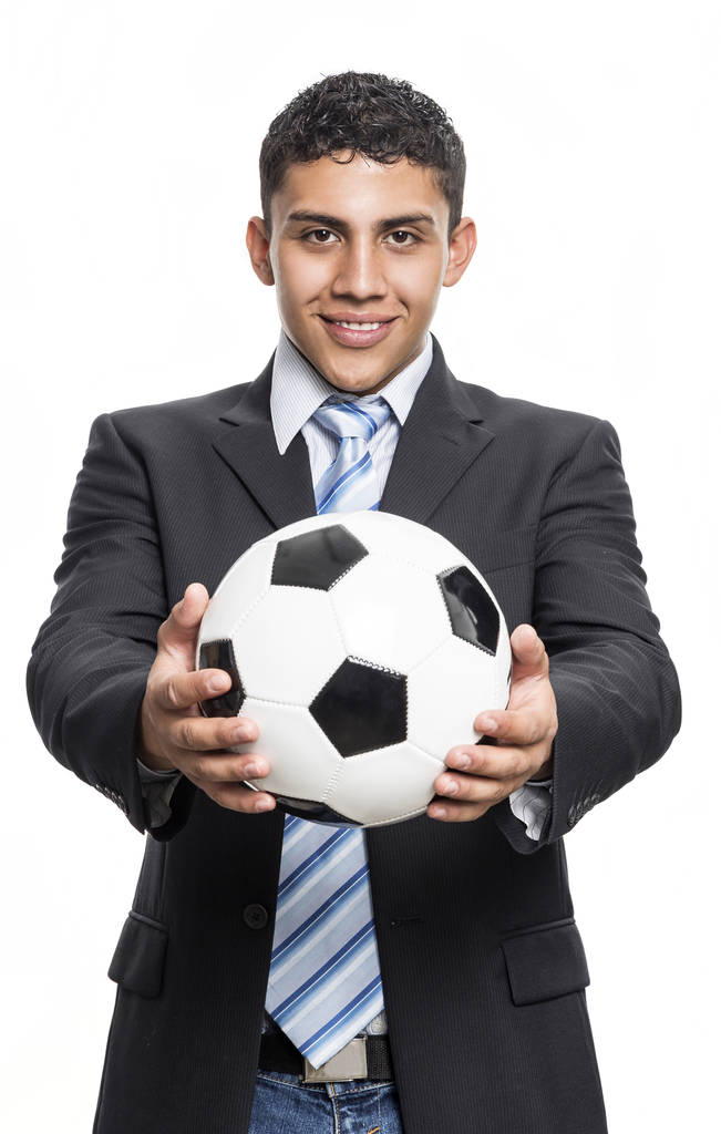 Młody człowiek executive, uśmiechając się z piłki nożnej w ręce - Zdjęcie, obraz