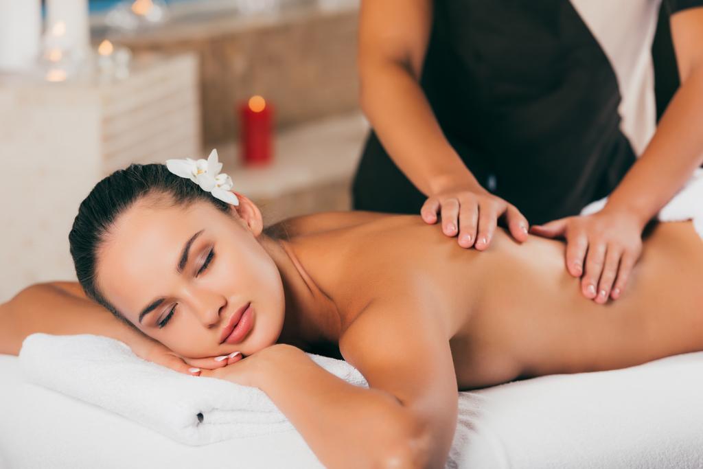 attractive woman having massage therapy at spa center - Photo, Image
