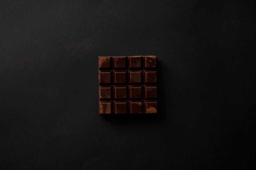 top view of gourmet sweet chocolate on black background - Photo, Image