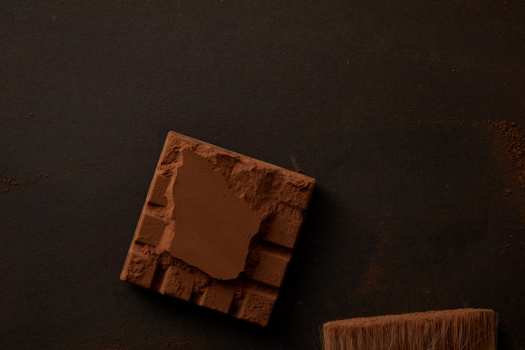 top view of sweet gourmet chocolate on black background  - Photo, Image