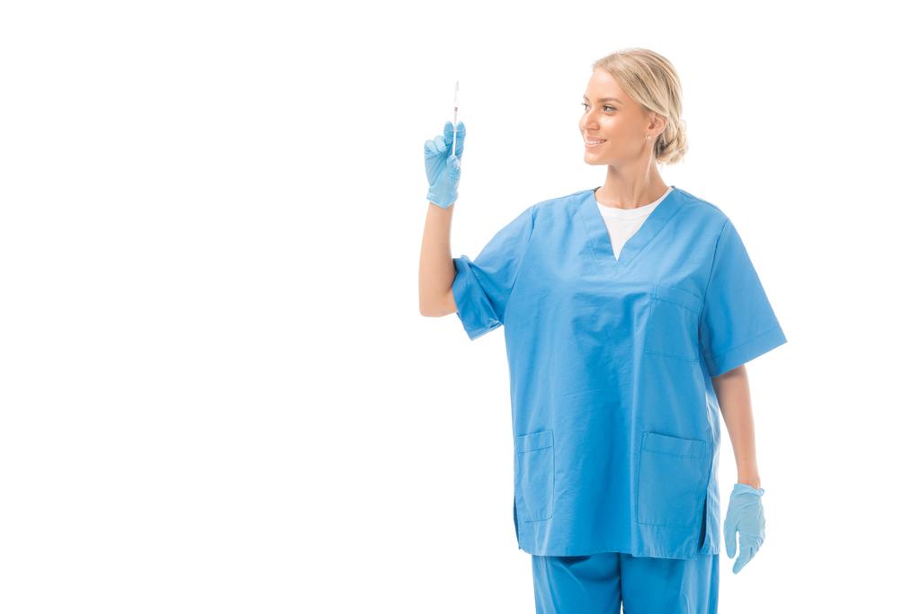 houkutteleva nuori sairaanhoitaja, jolla on valkoinen injektioruisku
 - Valokuva, kuva
