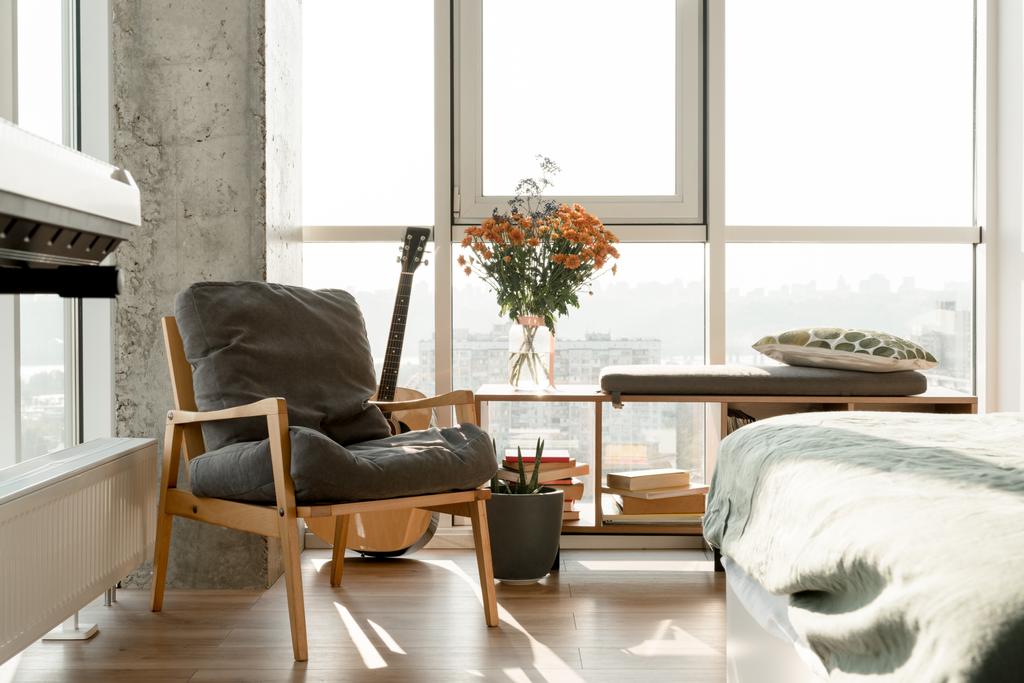 close up view of empty modern room interior with armchair at big window  - Photo, Image