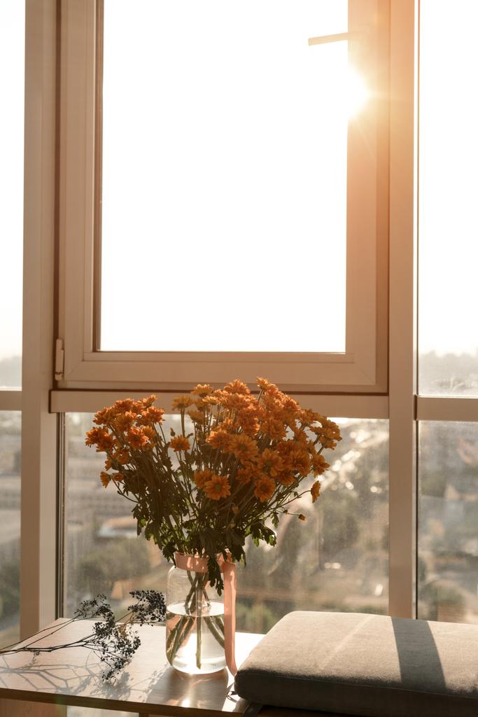close up view of beautiful bouquet of flowers standing at window - Photo, Image