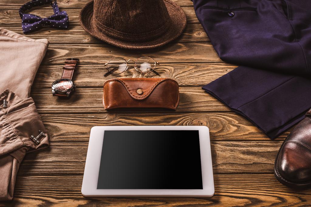 close up view of male accessories, stylish clothing and tablet on wooden tabletop - Photo, Image