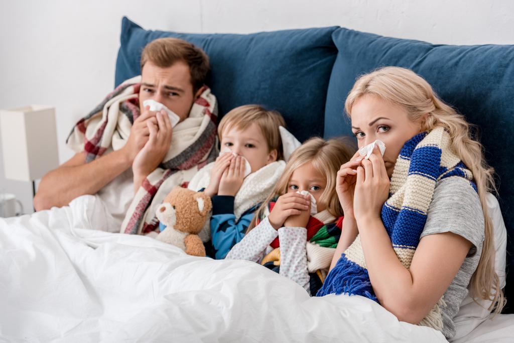sick young family lying in bed - Photo, Image