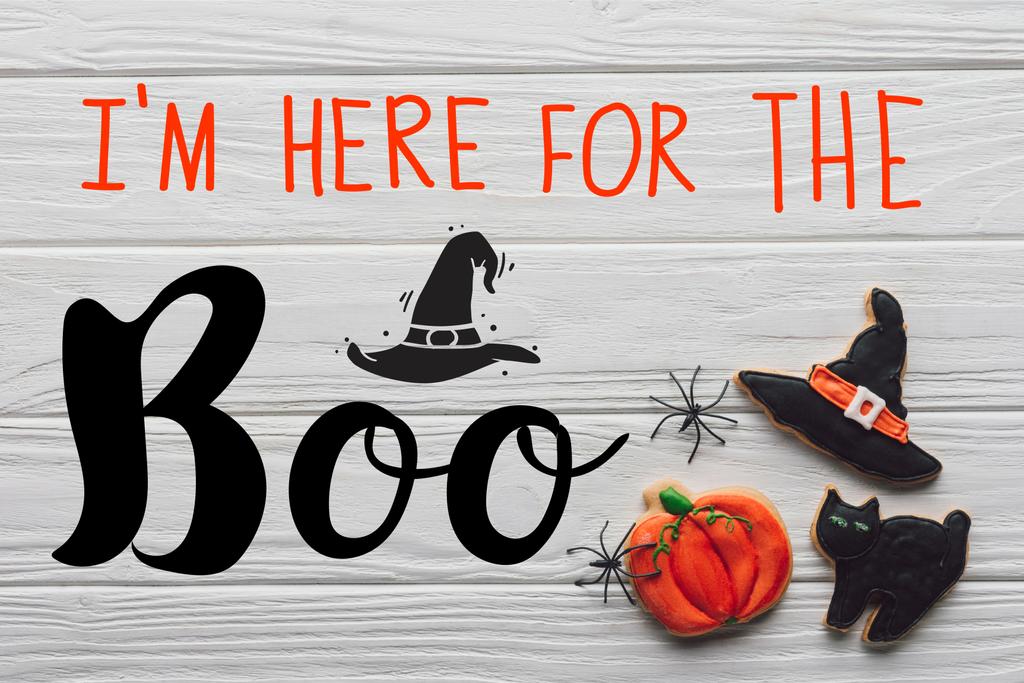 elevated view of tasty homemade halloween cookies on wooden background with "Im here for the Boo" lettering - Photo, Image