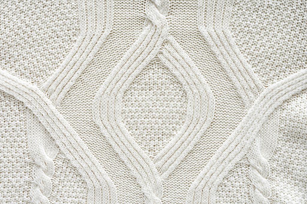 full frame of white knitted cloth with pattern as background - Photo, Image