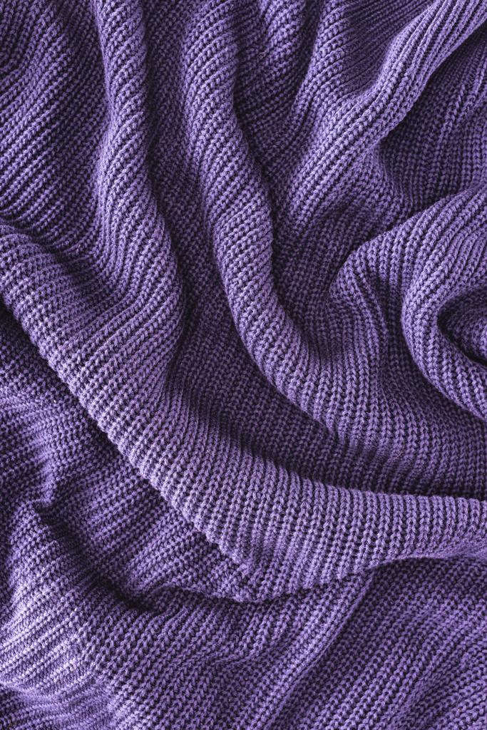 full frame of purple folded woolen fabric as background - Photo, Image