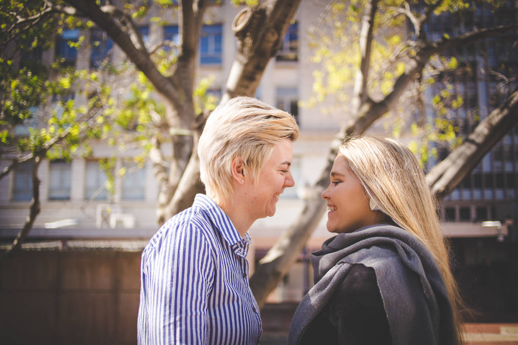 Close up image of a same sex female / lesbian couple  in the Cape Town South Africa city Center - Photo, Image